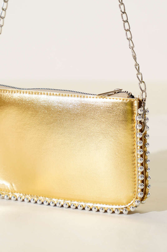 Sac bandoulière à chaîne cloutée dorée