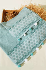 Set de 2 serviettes à pompons menthe