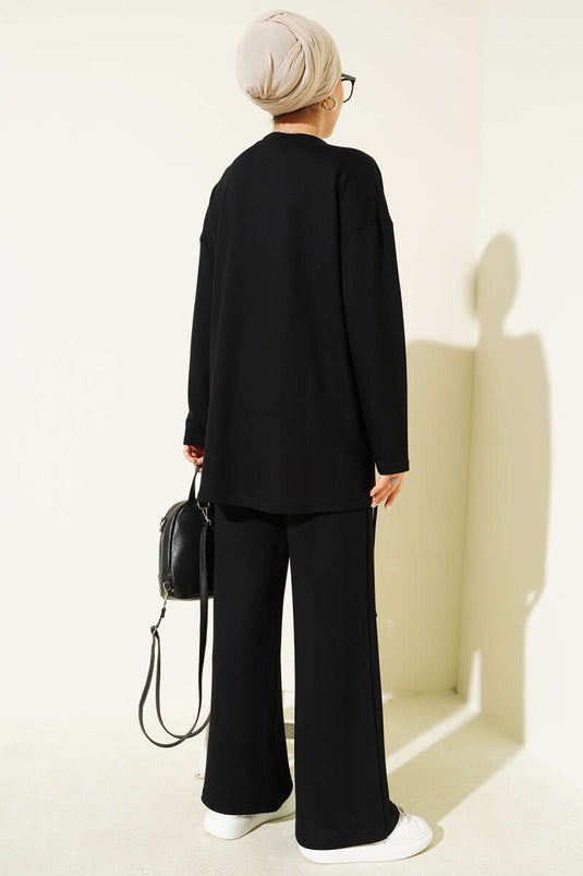 Ensemble deux pièces noir à col rond avec coupe asymétrique