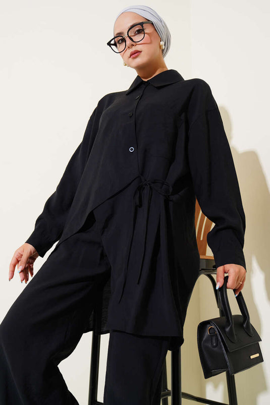 Costume deux pièces noir à coupe asymétrique et cordon de serrage