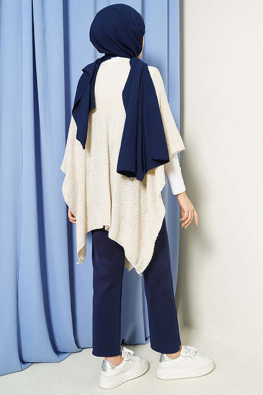 Poncho in maglia con taglio asimmetrico e pietre