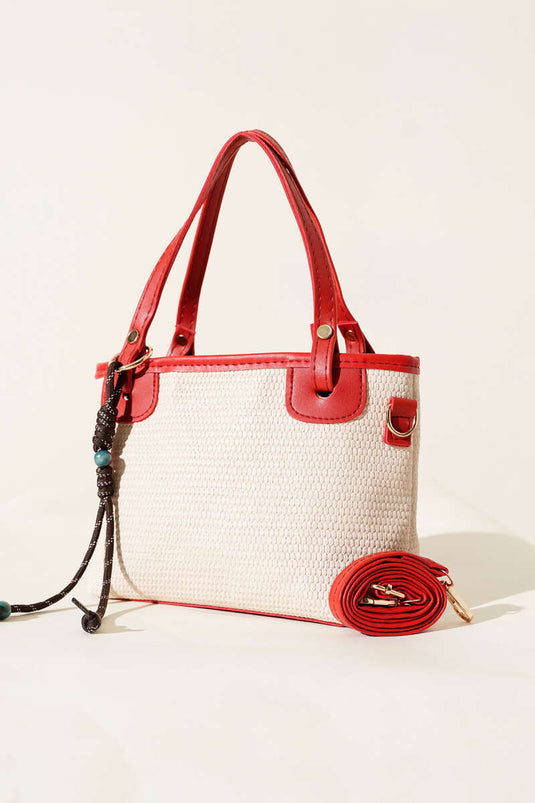 Borsa di paglia rossa con dettagli in pizzo