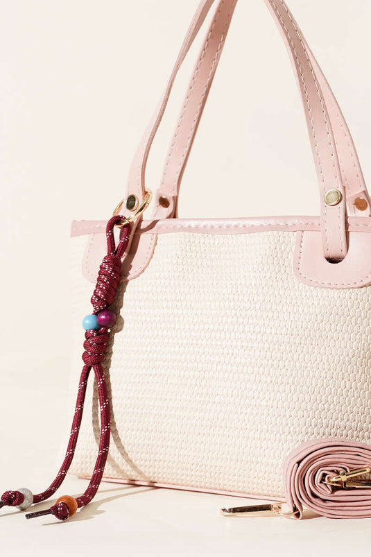 Borsa di paglia con rifiniture in pizzo, rosa cipria