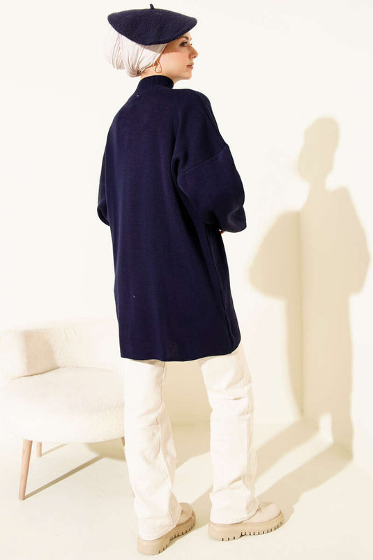 Tunique tricotée à col roulé et manches ballon bleu marine