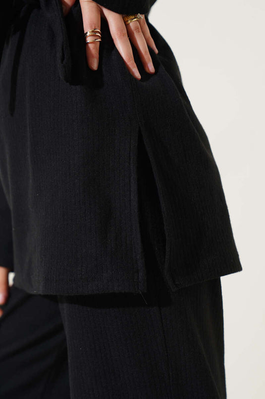 Ensemble deux pièces noir à col roulé côtelé et ceinture