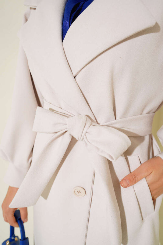 Manteau en cachemire écru à poignets ballon