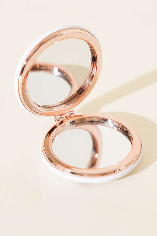 Assortimento di specchietti tascabili rotondi stampati 1