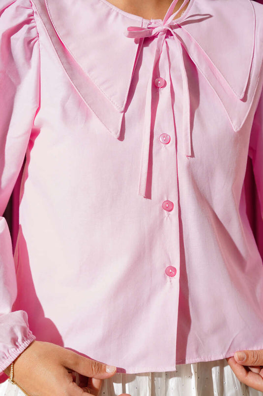 قميص قصير وردي اللون مع فيونكة للبنات