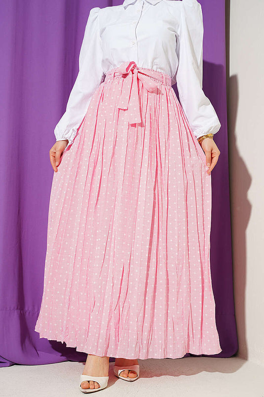 Jupe plissée à pois avec ceinture rose