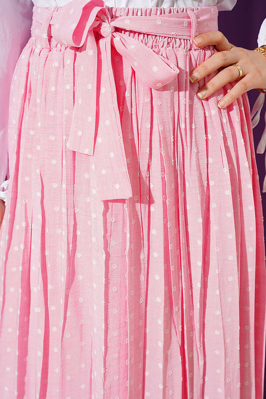 Jupe plissée à pois avec ceinture rose