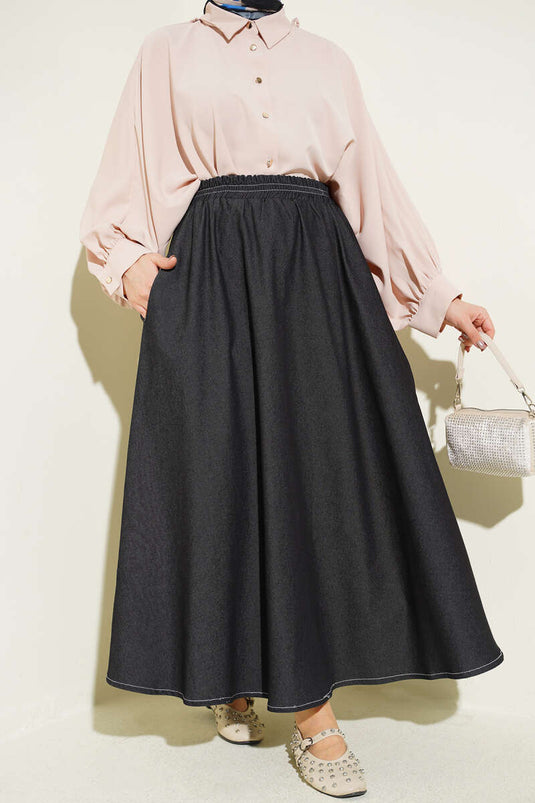 Jupe en jean noire avec ceinture élastique et poches détaillées