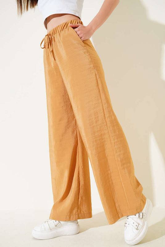 Pantalon brillant moutarde à taille élastique et jambes larges