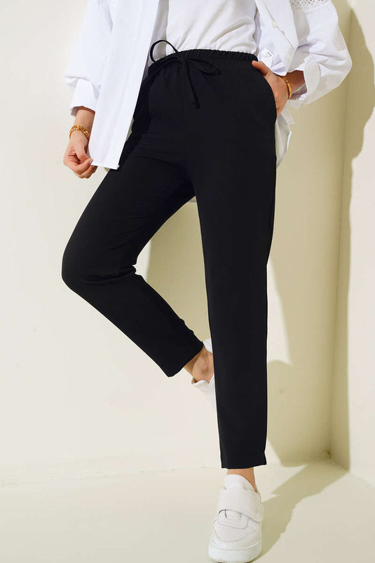 Pantalon à taille élastique avec poches en ficelle noir