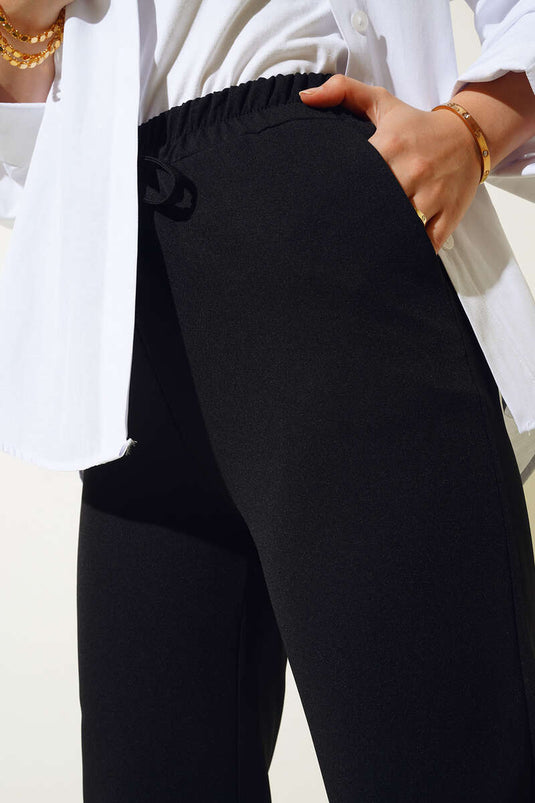 Pantalon à taille élastique avec poches en ficelle noir