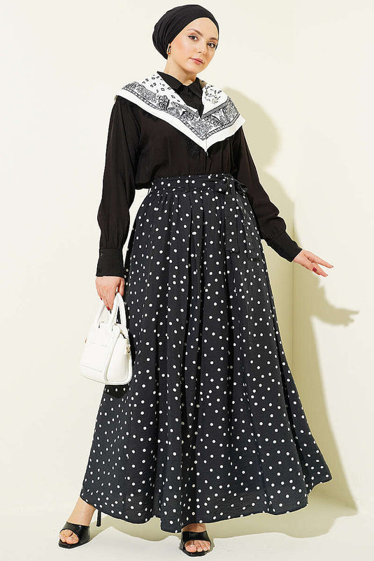 Jupe noire à pois avec ceinture élastique à la taille