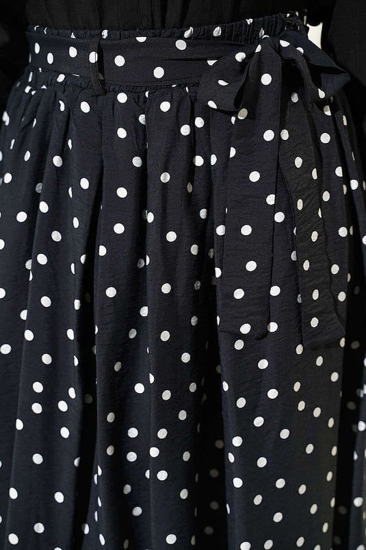 Jupe noire à pois avec ceinture élastique à la taille