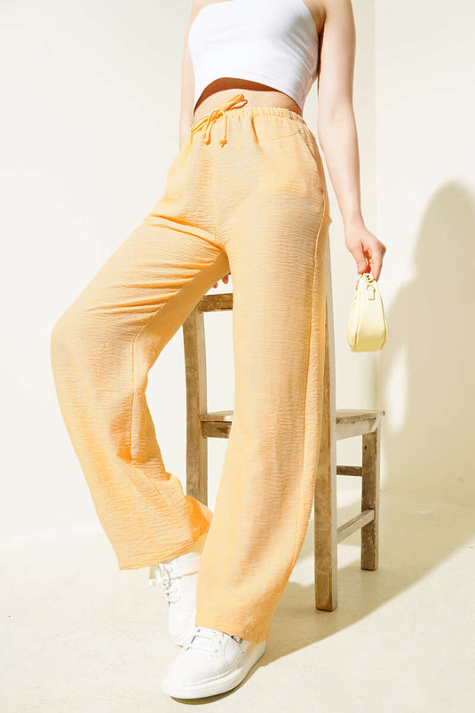 Pantalones de verano con cintura elástica en color naranja