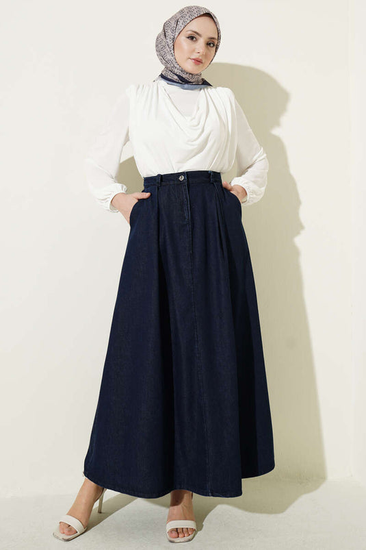 Gonna di jeans blu scuro con tasche e pieghe