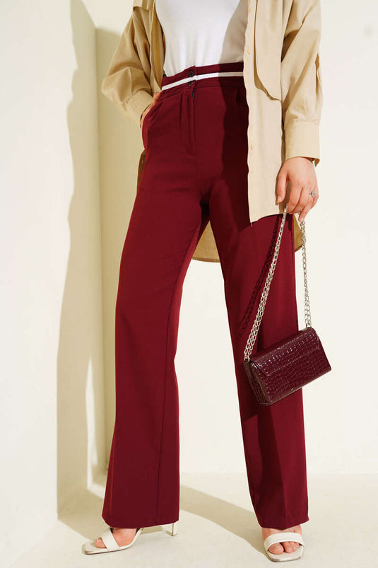 Pantalones Palazzo abotonados con raya en la cintura en color burdeos