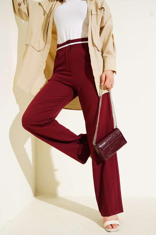 Pantalones Palazzo abotonados con raya en la cintura en color burdeos