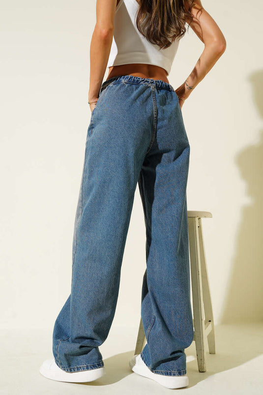 Jean en denim bleu à cordon de serrage et taille élastiquée