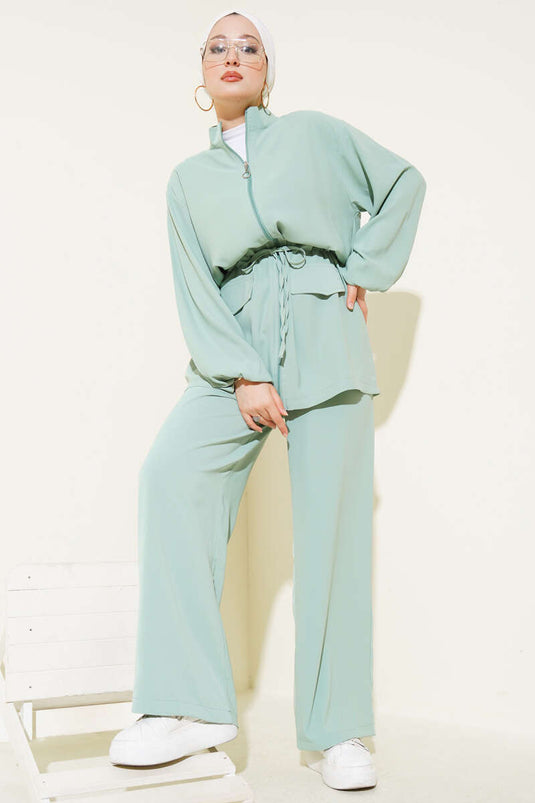 Combinaison deux pièces à rabat et poche zippée, taille tunnel, vert aqua