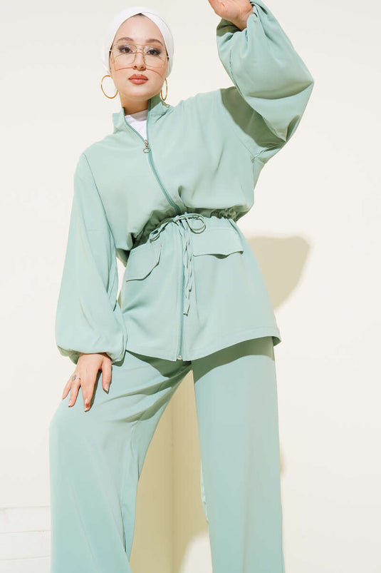 Combinaison deux pièces à rabat et poche zippée, taille tunnel, vert aqua