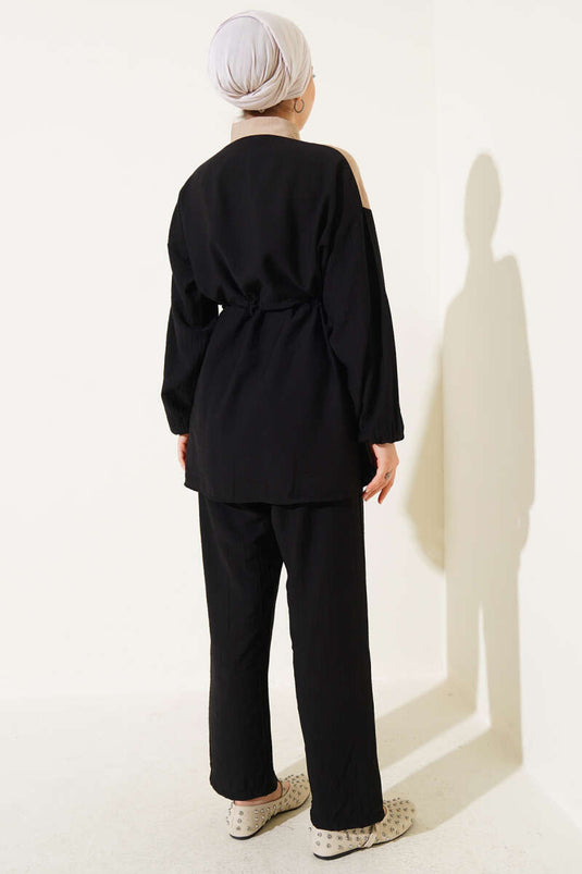 طقم من قطعتين مع نفق للخصر وحافة على شكل حرف V، أسود