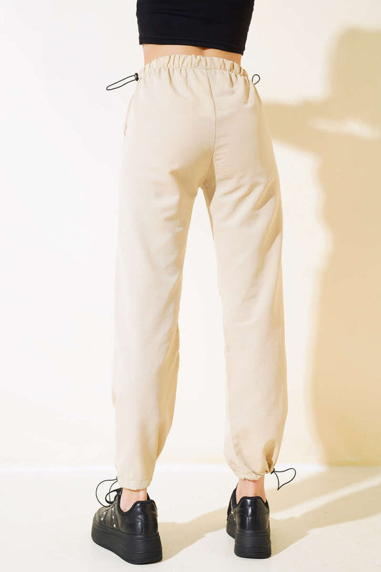 Pantalon parachute avec taille et jambes élastiques Beige