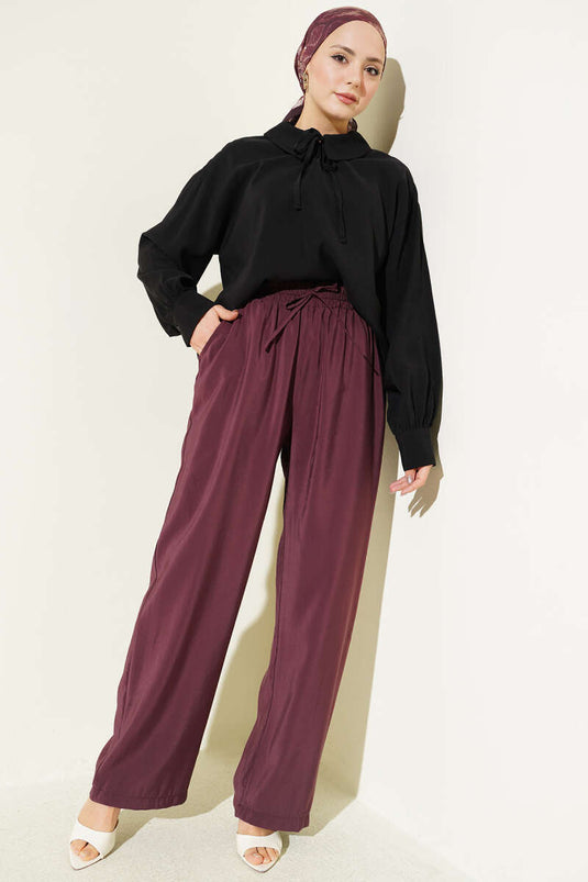 Pantalon en modal bordeaux avec poches et taille élastique