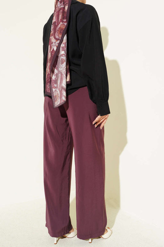 Pantalon en modal bordeaux avec poches et taille élastique