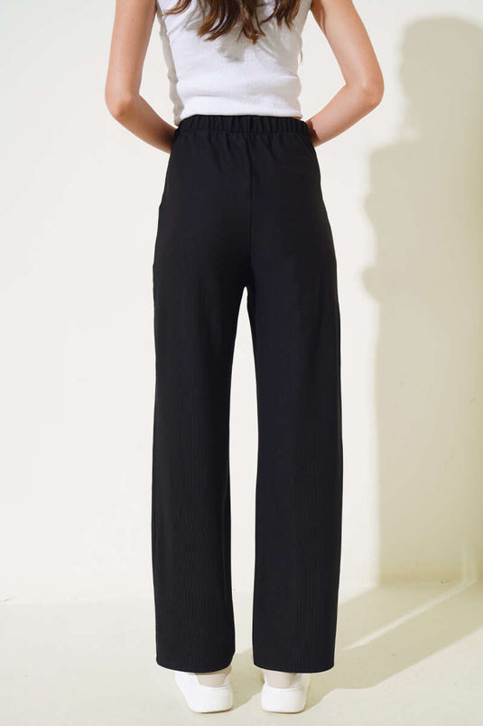 بنطلون أسود بخصر مطاطي وجيب