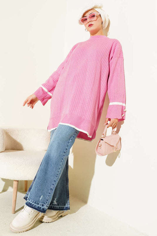 تونيك وردي محبوك مضلع بأزرار على الأكمام