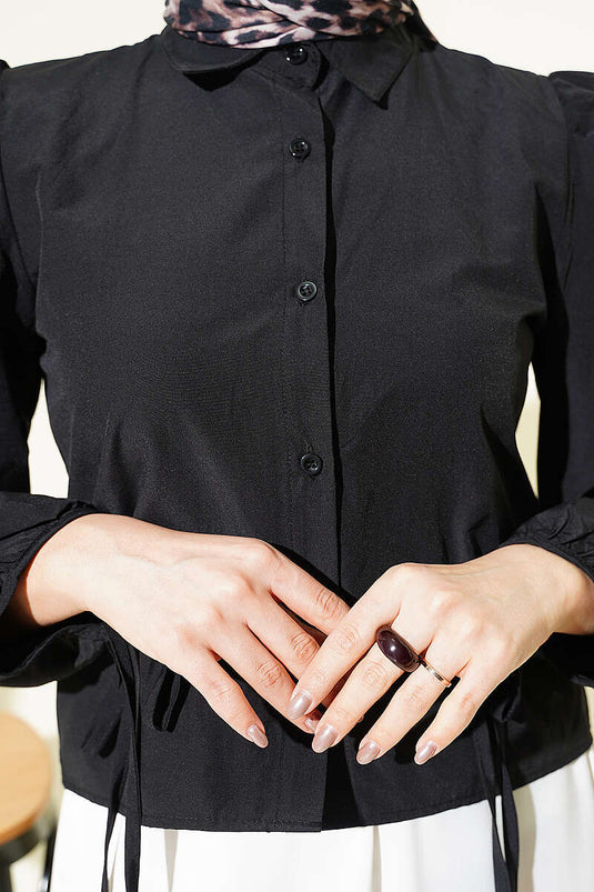 Camicia corta nera con maniche a palloncino e coulisse al polso