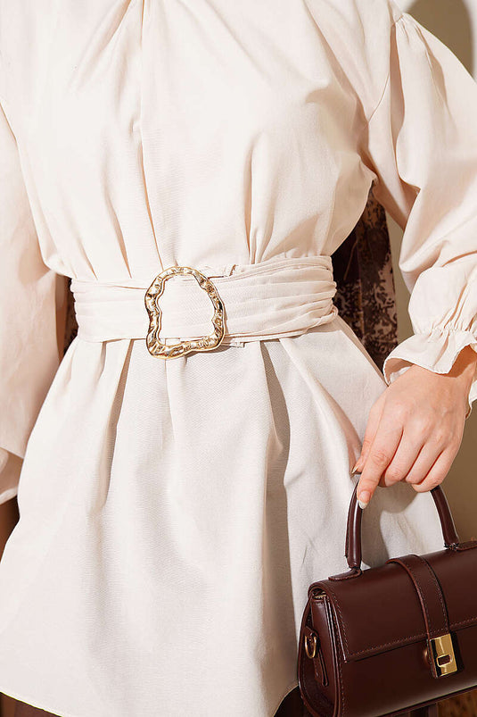 Tunique en popeline beige avec ceinture et poignets élastiqués