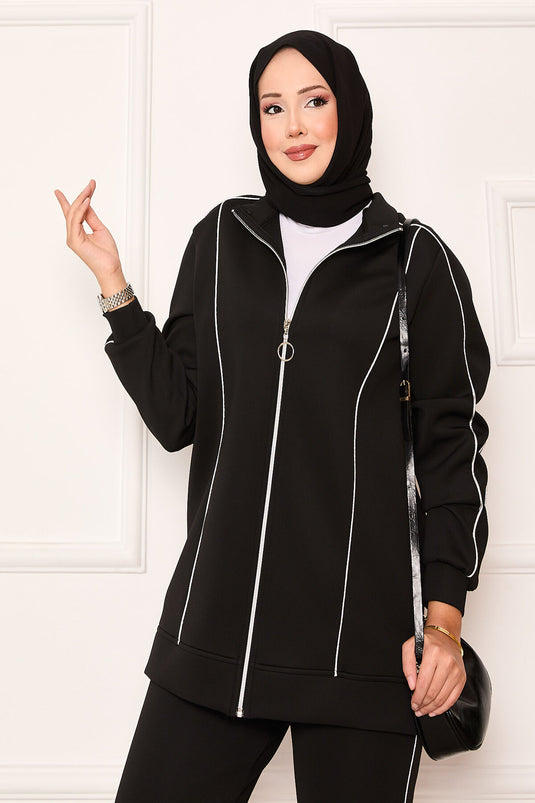 Costume deux pièces noir avec passepoils détaillés