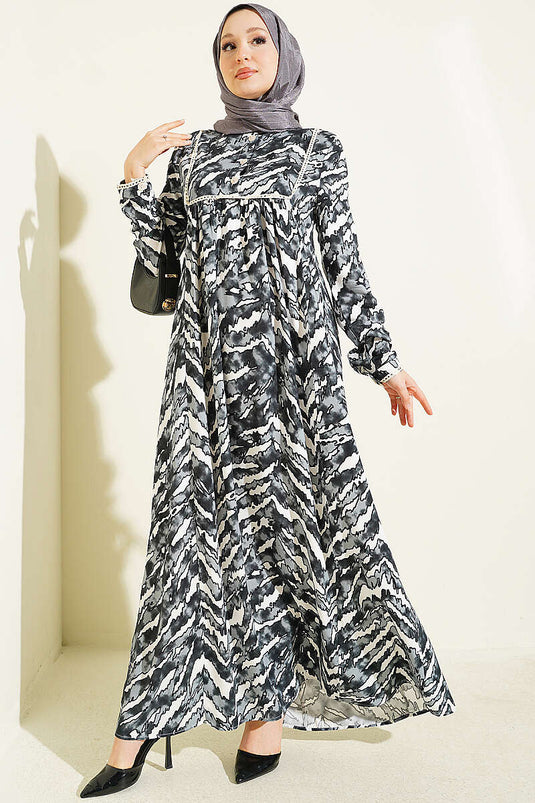 Schwarzes Langarmkleid Mit Spitzenmuster An Brust Und Taille