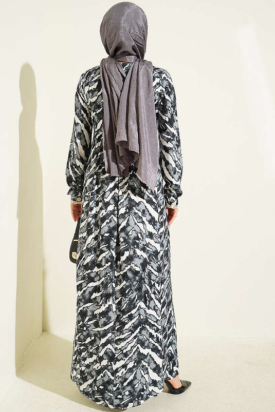 Schwarzes Langarmkleid Mit Spitzenmuster An Brust Und Taille