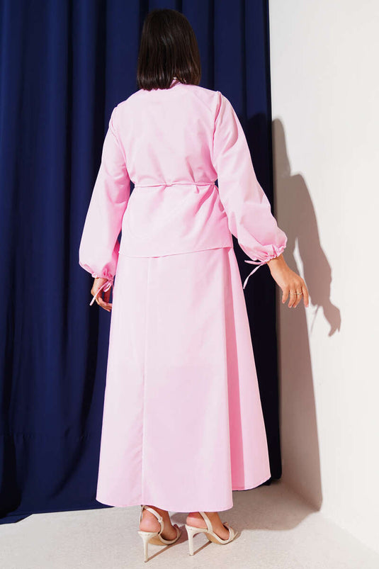 طقم تنورة مزدوجة بأزرار من بريت باللون الوردي