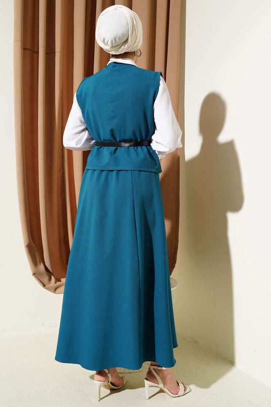 Tailleur deux pièces avec boutons croisés, ceinture et jupe pétrole