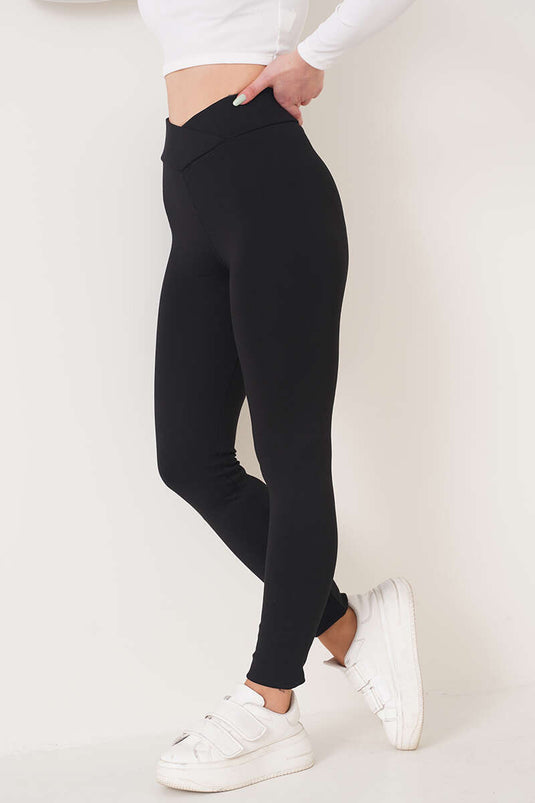 Leggings mit Kreuzgürtel in Schwarz