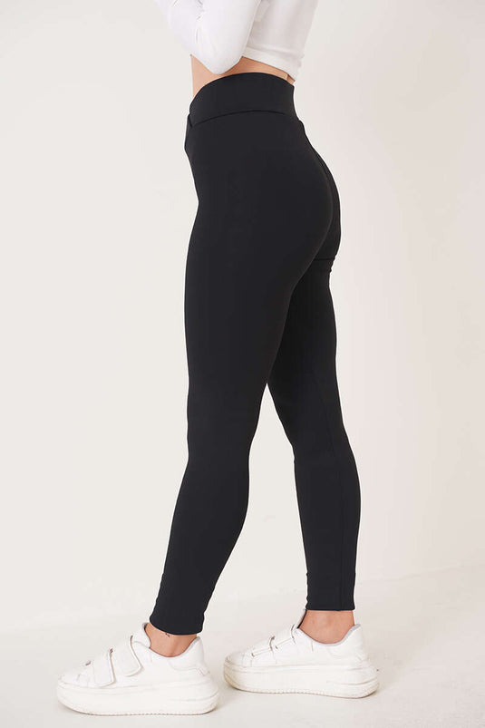 Leggings mit Kreuzgürtel in Schwarz