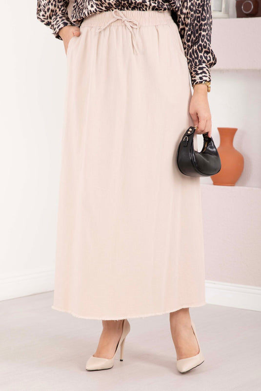 Jupe beige à ceinture élastiquée avec détails en perles