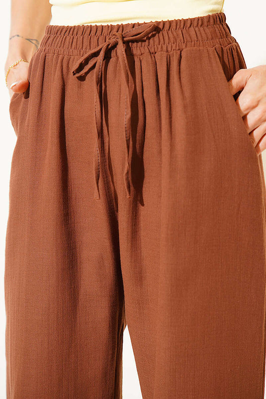 Pantalon en mousseline avec poches et taille élastique, couleur café