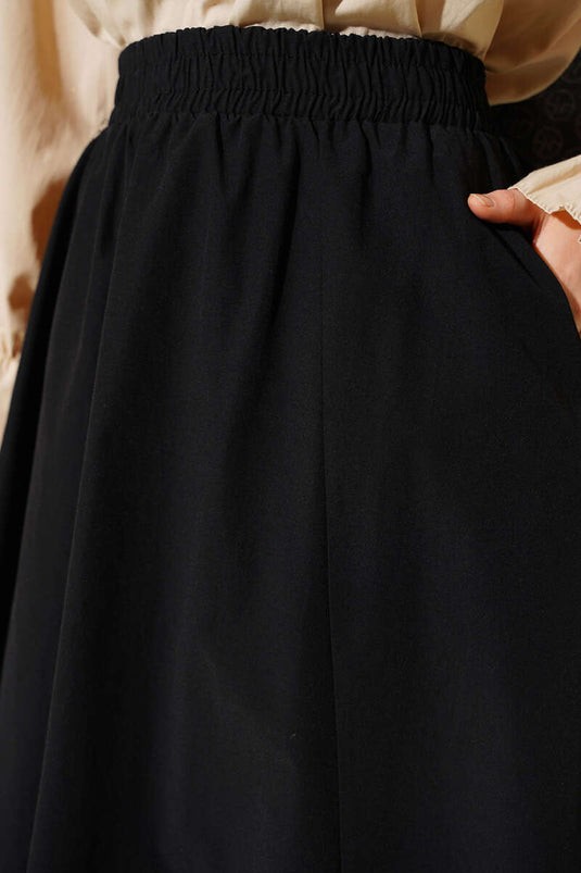 Jupe droite noire à taille élastiquée avec poches
