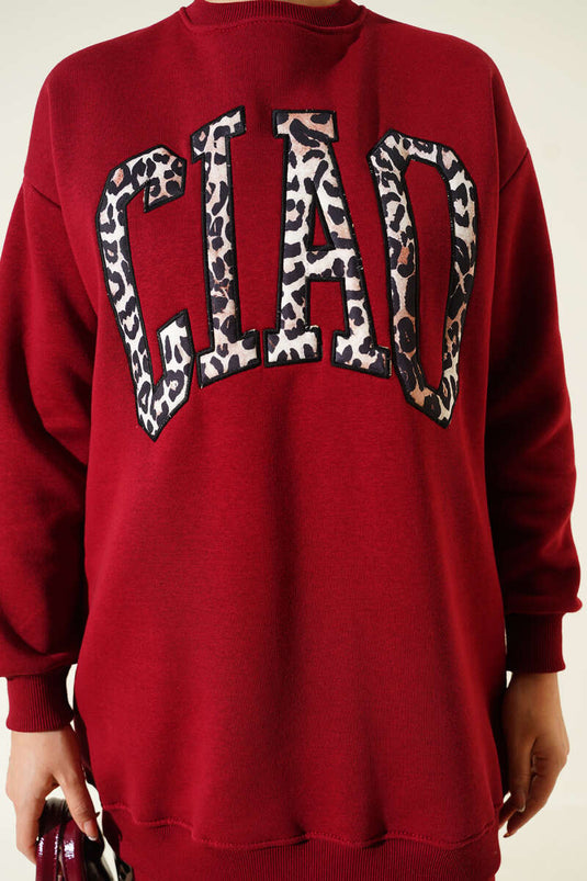 بدلة من قطعتين بثلاثة خيوط مطبوعة بنقشة جلد النمر باللون العنابي