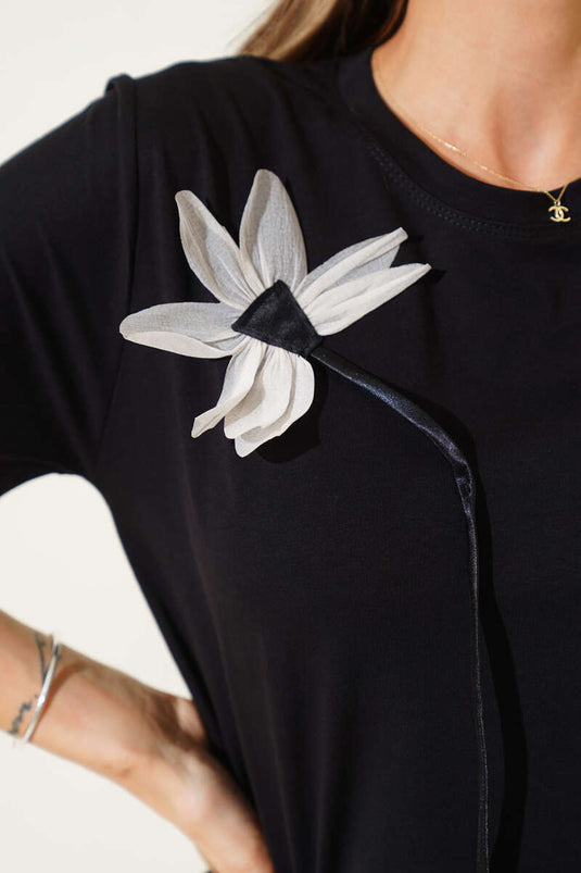 Black T-Shirt with Floral Accessories