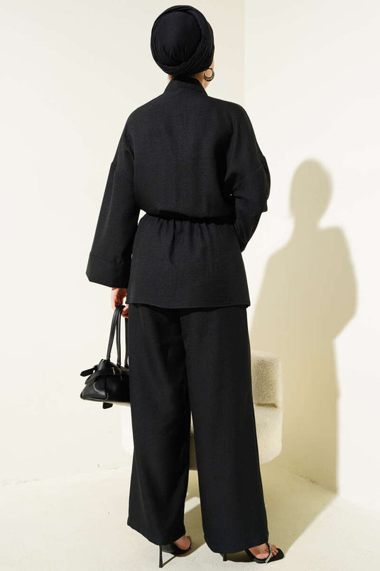 Costume deux pièces noir à double poche et ceinture à nouer