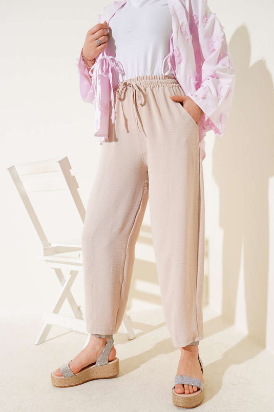 Pantalones con cinturón Chimali Beige