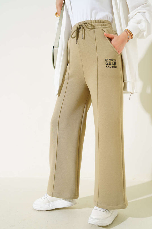 Pantalon kaki à jambes larges et ourlet élastiqué